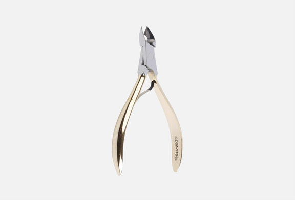 Tweezerman Cuticle Clippers on a marble grooming table in NYC
